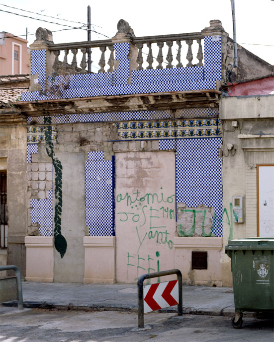 Rapunzel house with painted braid on the facade. Photo